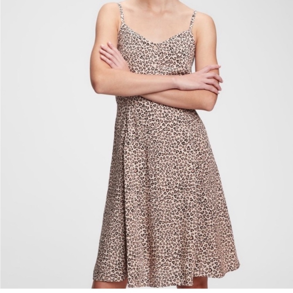 Cheetah heart print smocked cami dress with adjustable straps.